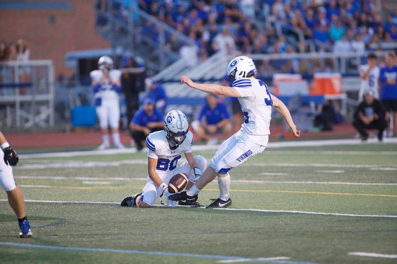 Geneva's Luke Ignoffo holds the ball for the field goal kick by Benjamin Schmidt against St. Charles North on Sept. 12, 2025 in St. Charles.