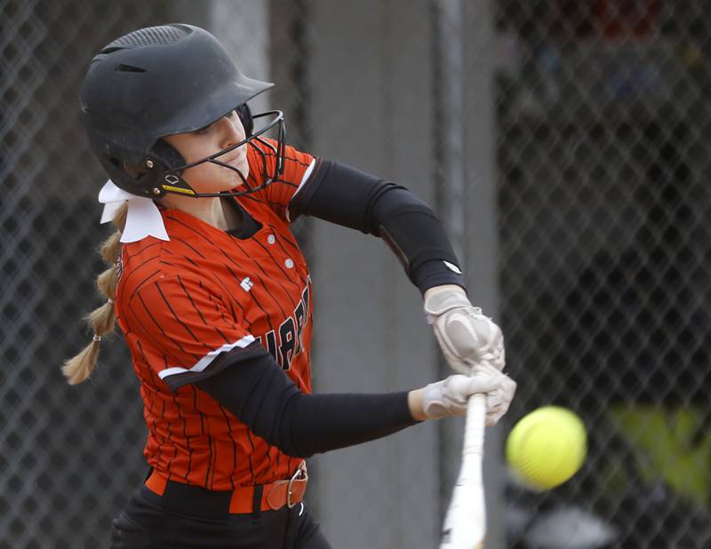 McHenry’s Tatum Kornfeind connects with the ball during a Fox Valley Conference Softball game Monday, May 2, 2022, between Cary-Grove and McHenry at Cary-Grove High School.