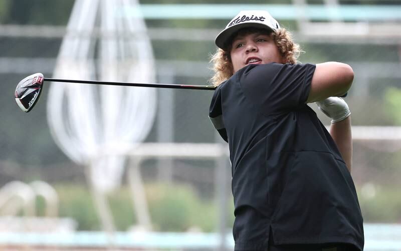 Sandwich’s Kai Kern hits a drive Wednesday, Sept. 27, 2023, during the Class 2A boys golf regional at Sycamore Golf Club.