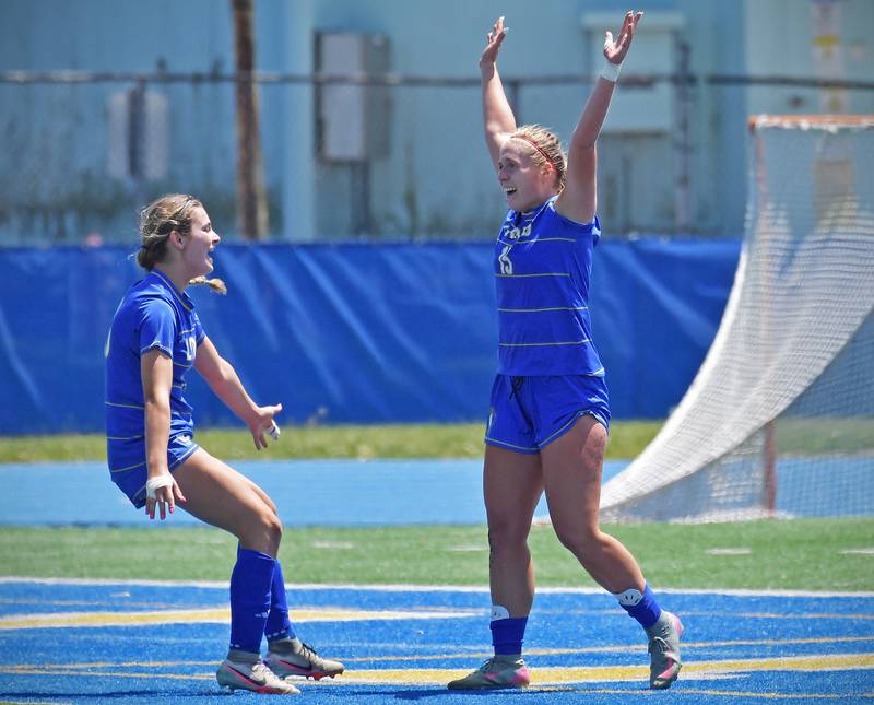 Lyons Township’s Abby McKenna (left) who scored the first goal, and Zibby Michaelson celebrate Michaelson’s goal during their 2-0 overtime win in the Class 3A Lyons Regional final against Downers Grove North on May 23, 2026 at Lyons Township High School in LaGrange.