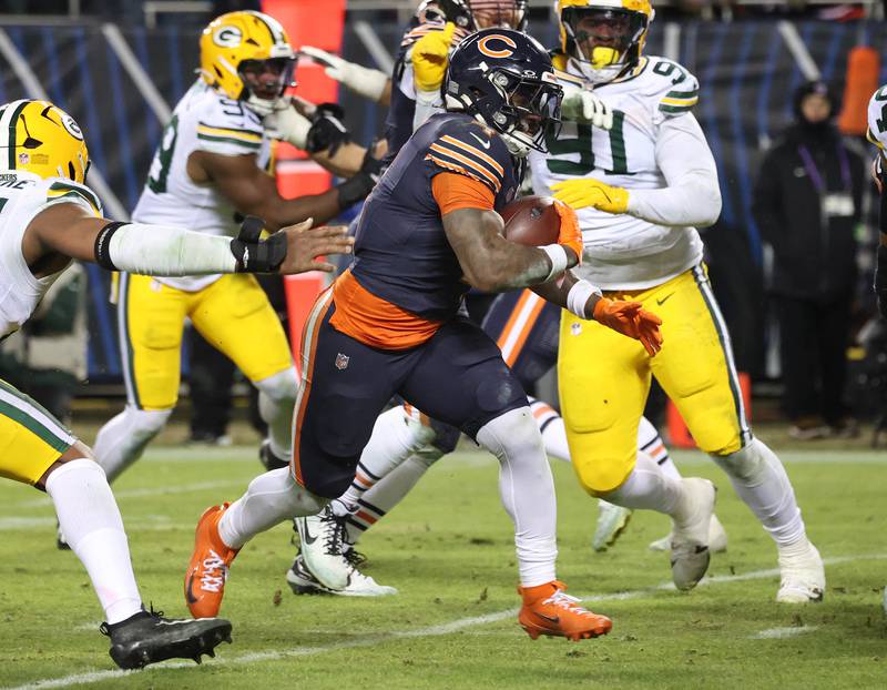 Chicago Bears running back D'Andre Swift breaks through the Green Bay Packer defensive line for a touchdown during their NFL Wild Card game Saturday, Jan. 10, 2026, at Soldier Field in Chicago.