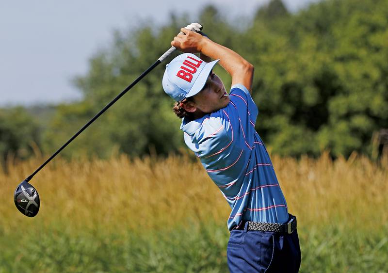 Marian Central’s Peter Louise watches his tee shot on the first hole of the Prairie course Wednesday, July 13, 2022, during the second round of the the McHenry County Junior Golf Association's McHenry County Junior Amateur tournament at Boone Creek Golf Club, in Bull Valley.