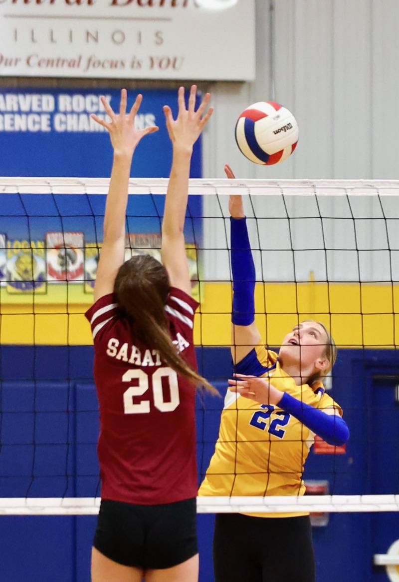 Princeton Logan's Ava Munson makes a block in Monday's Class 3A 8th grade sectional finals at Pannebaker Gym. The Lions fell in three sets to Morris Saratoga.