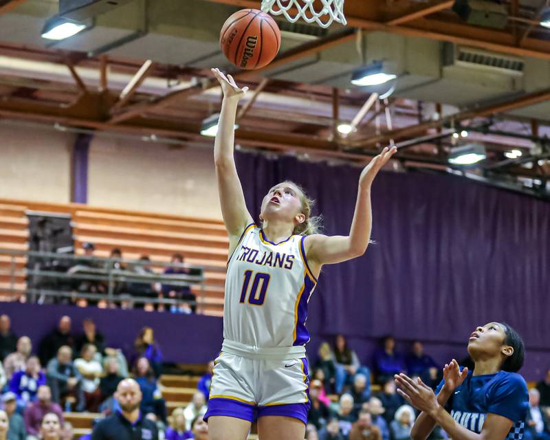 Downers Grove North's Hope Sebek (10) puts in a lay up during girls basketball game between Downers Grove South at Downers Grove North. Dec 16, 2023.