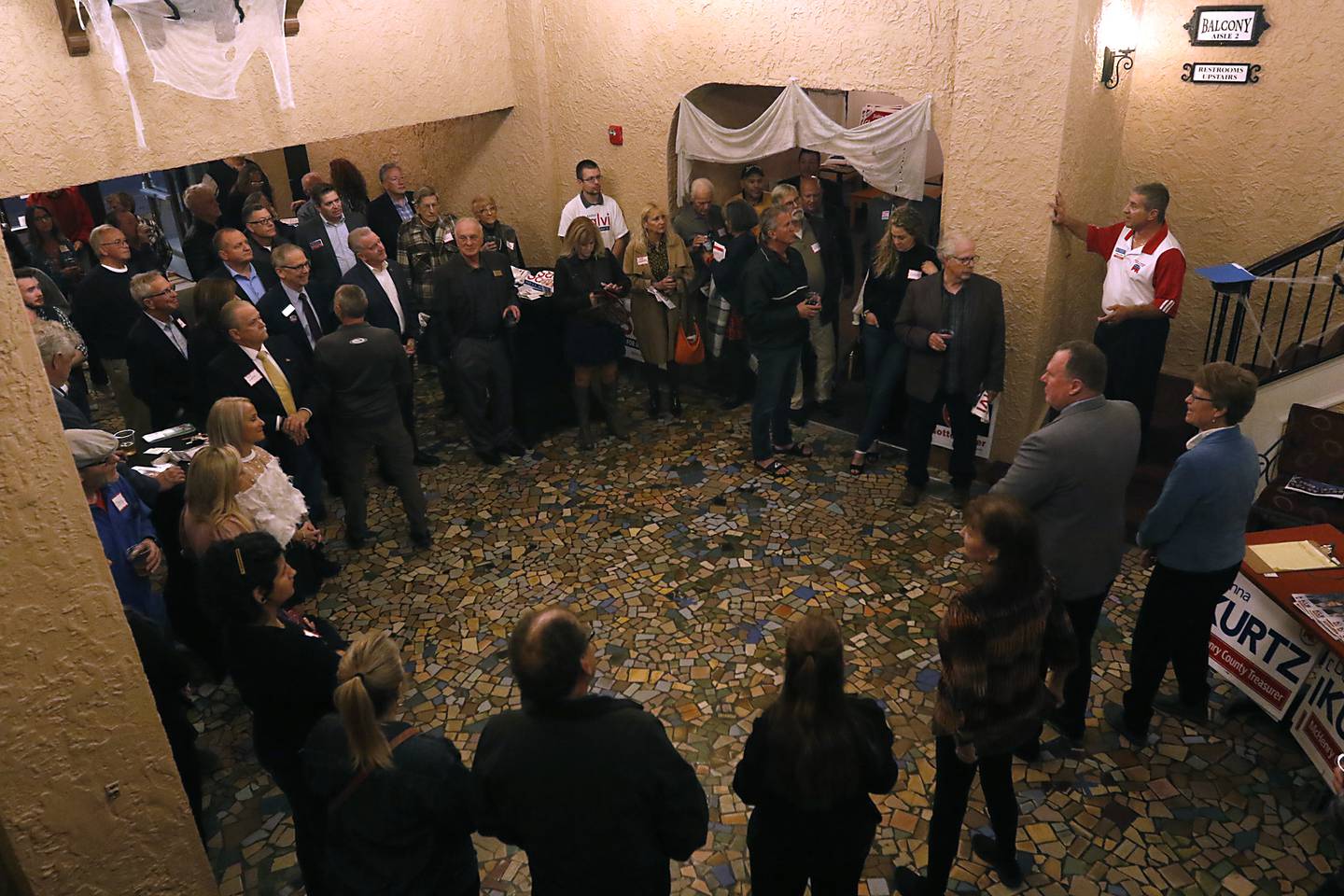 Mark Daniel, right on stairs, speaks during a meet-and-greet event Wednesday, Oct. 12, 2022, for Republican candidates across the state and McHenry County at the Raue Center for the Arts, 26 N. Williams St. in Crystal Lake. The event gave voters a chance to discuss a number of key issues and talk with candidates.