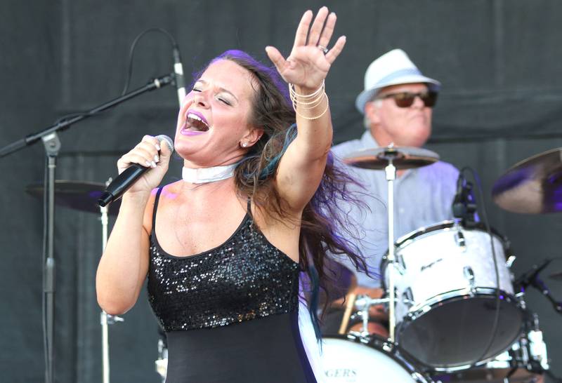 Rockin' Moxie performs on the sound stage Friday Aug. 27, 2021, at Corn Fest in downtown DeKalb. The festival runs through Sunday and features rides, food, crafts and entertainment.