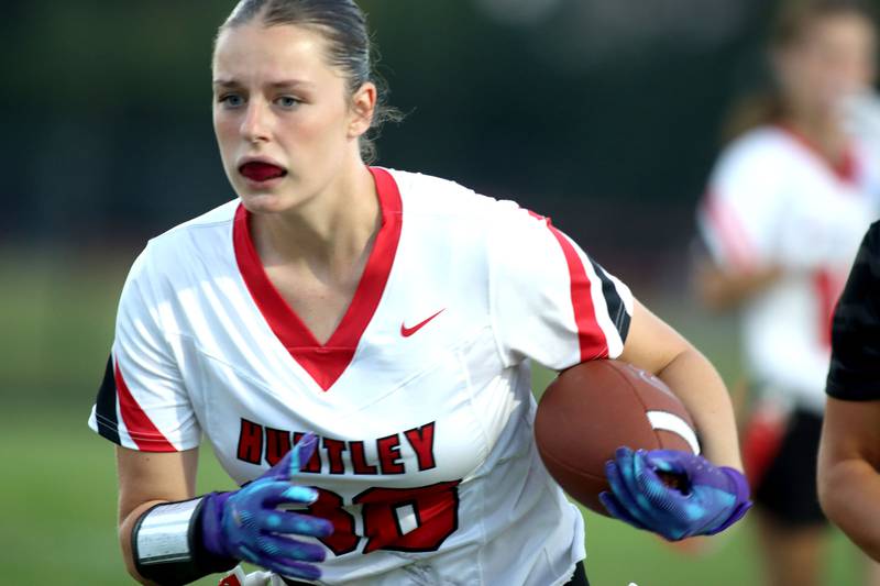 Huntley’s Elena Fetzer moves the ball in varsity flag football at Owen Metcalf Field on the campus of Crystal Lake Central High School in Crystal Lake on Tuesday, Sept. 16, 2025.