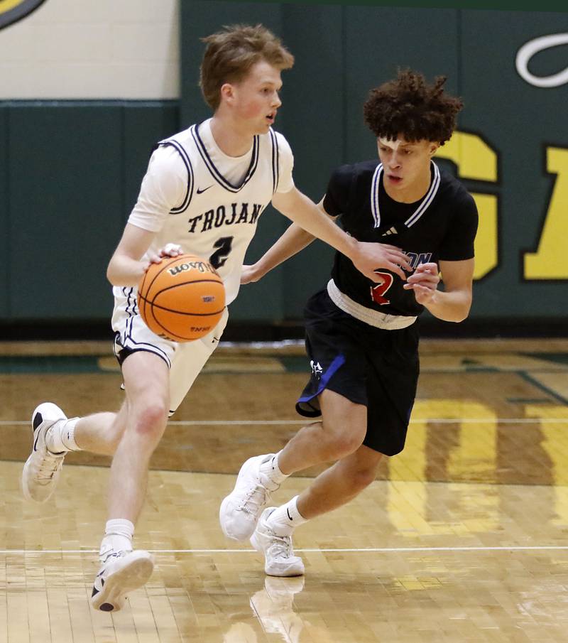 Cary-Grove's AJ Berndt brings the ball up the court against Marmion's Caden Anderson during an IHSA Class 3A Crystal Lake South Regional boys basketball semifinal game on Wednesday, February, 25, 2026, at Crystal Lake South High School.