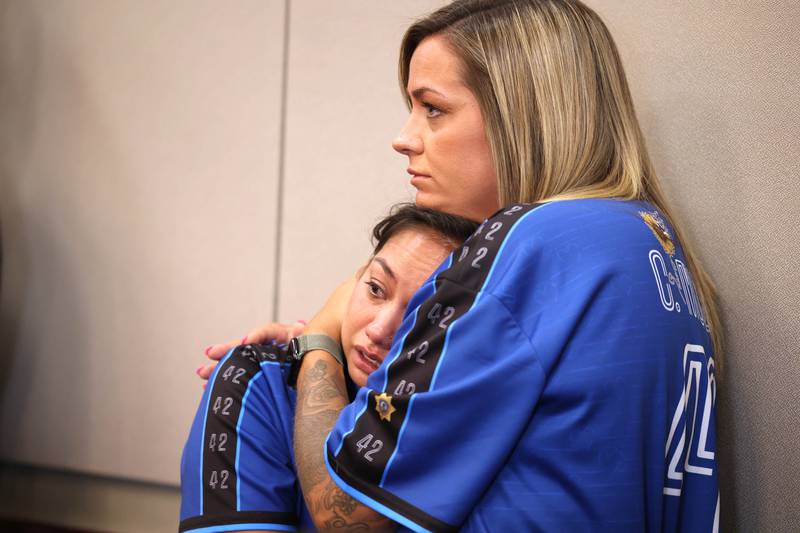 Yvonne Horton (left) and Hollie Lass, friends of DeKalb County sheriff‘s deputy Christina Musil, become emotional Thursday, June 26, 2025, as as lead prosecutor Scott Schwertley recounts the details of the 2024 crash that killed Musil during plea hearing for Nathan Sweeney at the DeKalb County Courthouse in Sycamore. Sweeney pleaded guilty Thursday for driving under the influence on March 28, 2024, and causing a crash that killed Musil.