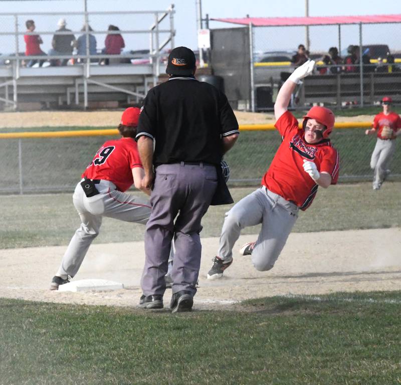 Amboy's L. Montavon slldes safely into third base for a triple during a Thursday, April 13 game against Forreston.