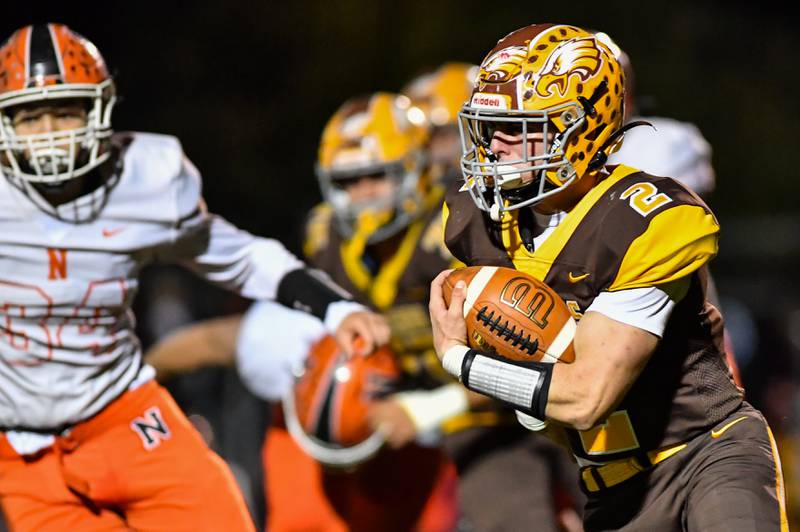 Jacob's Benjamin Ludlim runs for a nice gain early in the first quarter against Normal during their IHSA Class 7A second-round playoff game on Friday, Nov. 5, 2021 at H.D. Jacobs High School in Algonquin.