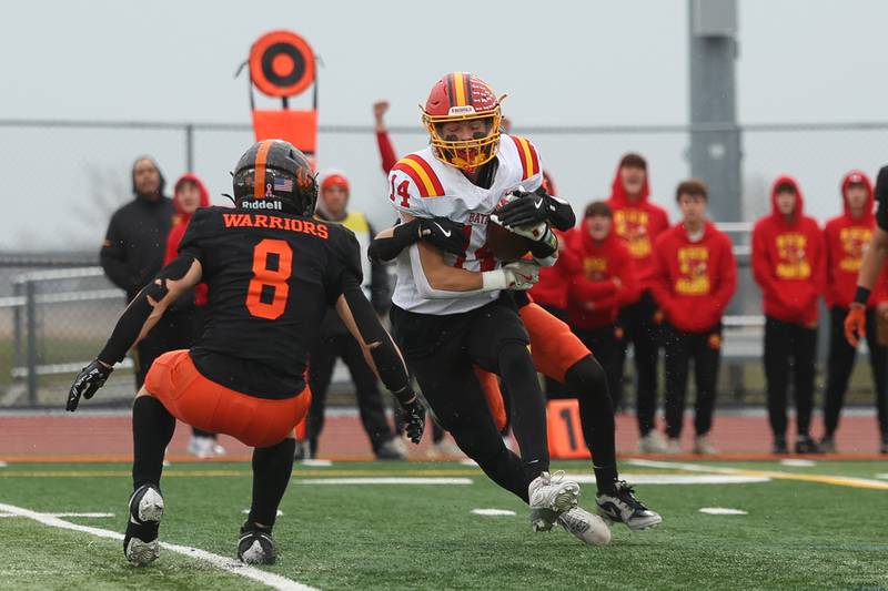 Batavia’s Jake Mysliwiec pulls in a pass for the first down against Lincoln-Way West on Saturday, Nov. 9, 2024 in New Lenox.