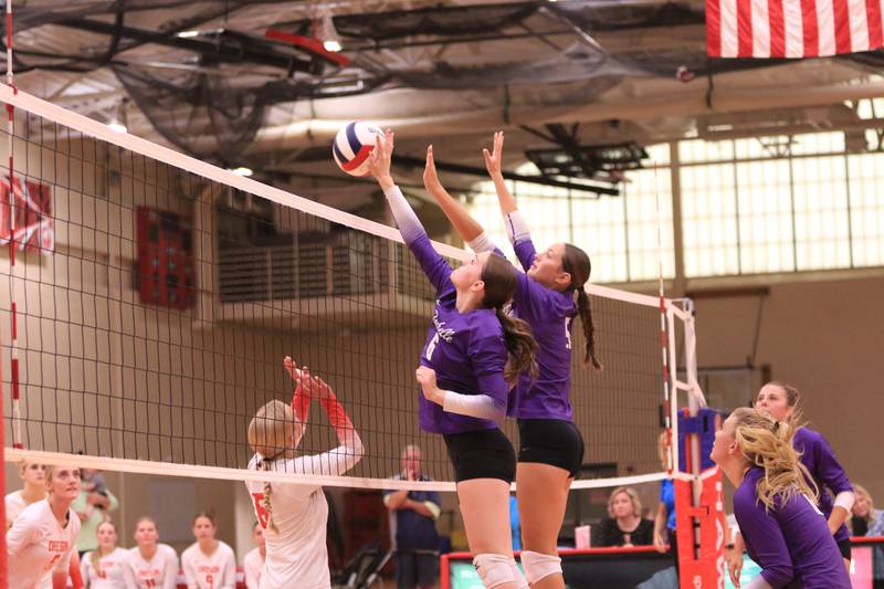 Rochelle's Audyn Kemp (5) and Briel Metzger (6) go up for a block during a match with Oregon on Sept. 2, 2025