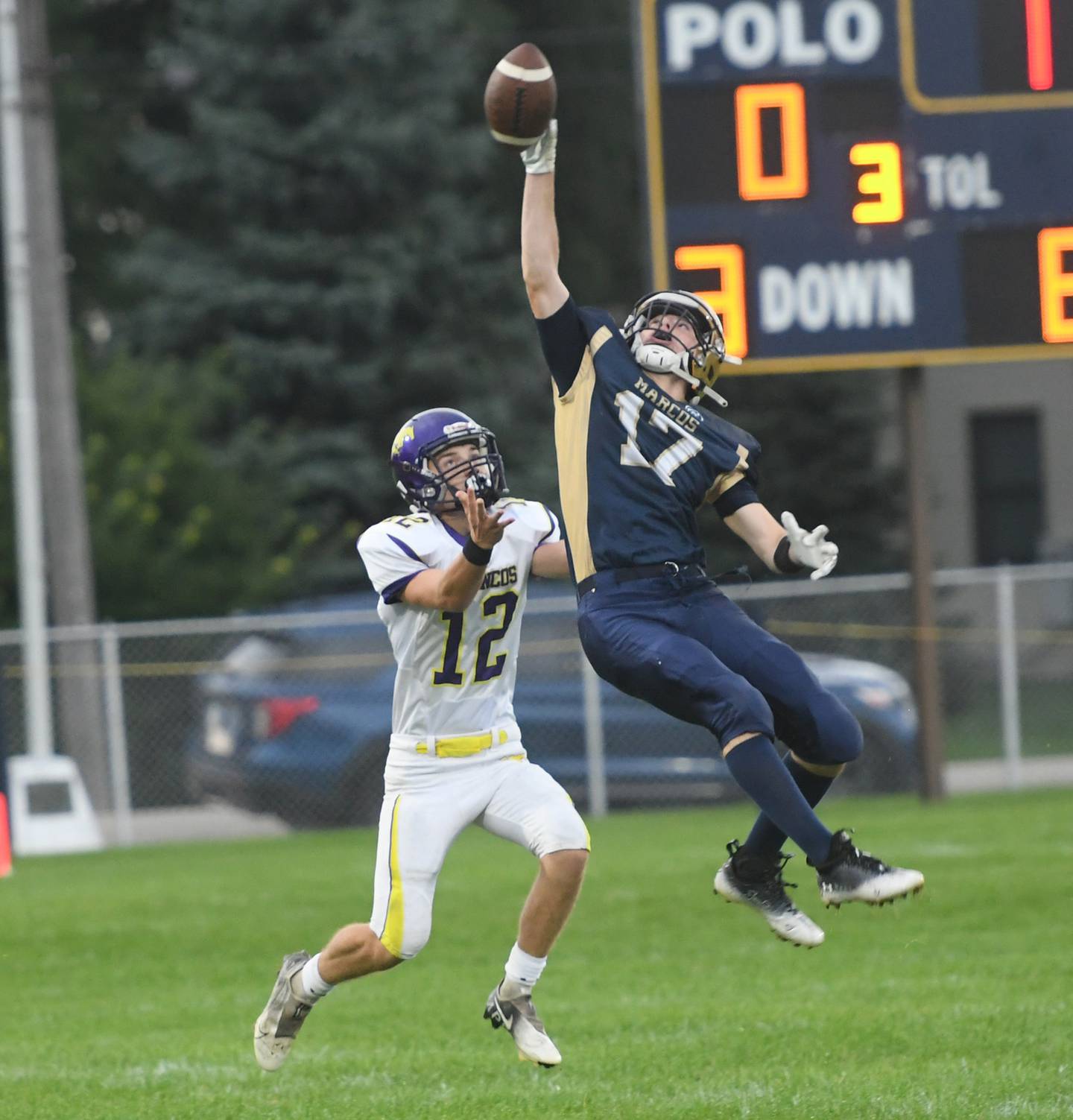 Polo's Brock Soltow knocks a pass away from Orangeville's Kyle Kloepping during 8-man football action in Polo on Saturday, Sept. 3.