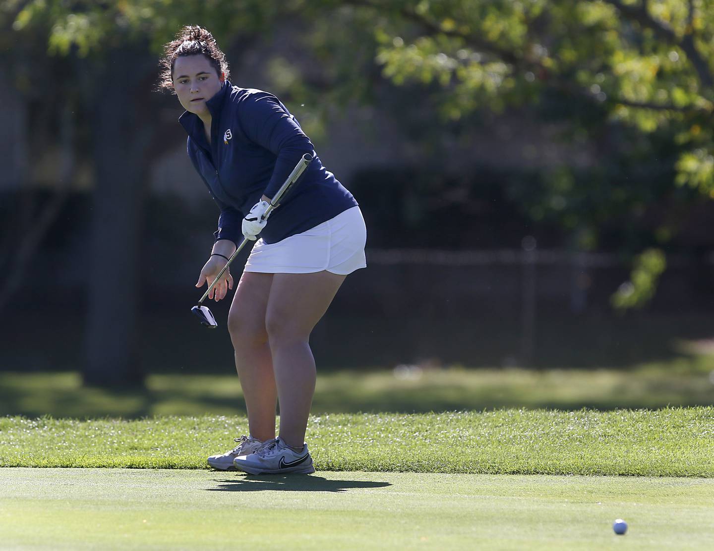 Sterling’s Emily Schwingle watches her putt on the first green during the IHSA Class 2A Huntley Girls Golf Regional on Tuesday, Oct. 1, 2024, at Pinecrest Golf Club in Huntley.