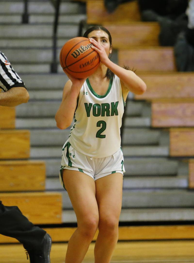 York's Anna Filosa (2) takes a three-point shot during the girls varsity basketball game between Lyons Township and York high schools on Friday, Dec. 16, 2022 in Elmhurst, IL.