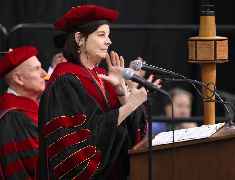 Northern Illinois University President Lisa Freeman claps for the candidates for graduation during the first of two undergraduate commencement ceremonies Saturday, May 11, 2024, in the Convocation Center at NIU in DeKalb.