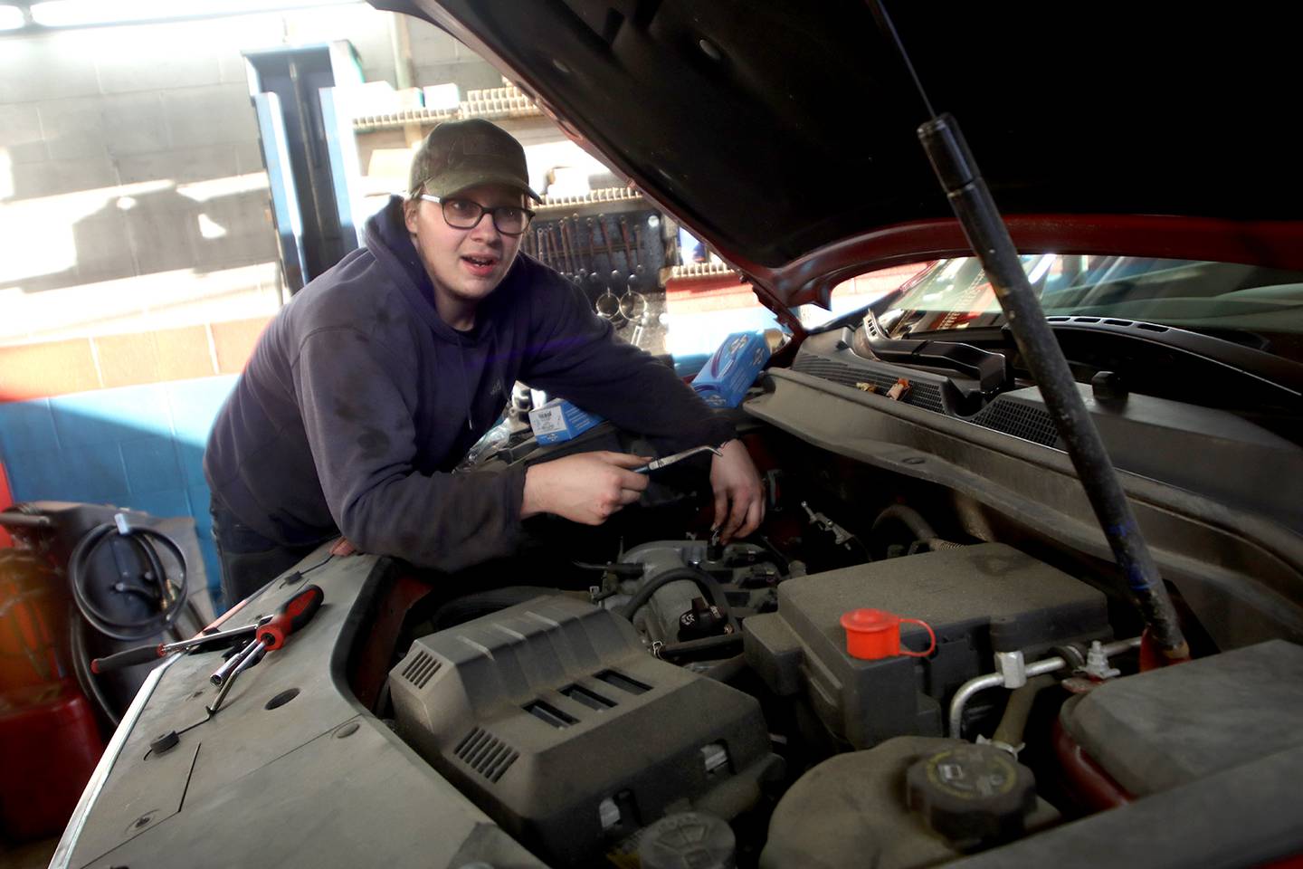 Technician Chris Dziedzic replaces a solenoid on a 2015 Chevy at Cary Tire and Auto on Thursday, Dec. 16, 2021. The local shop has experienced some of the worldwide supply chain delays which have impacted the cost and availability on replacement vehicle parts. While supply issues did not impact the repair of this particular car, Dziedzic said he has seen recent wild fluctuations on prices and sparse availability for brake rotors.