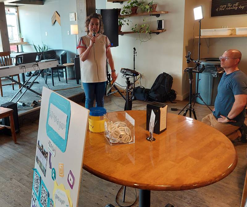 Poco a Poco founder Kate Tombaugh introduces performers Wednesday, June 14, 2023, during the festival's coffeehouse concert at More on Main in Streator.