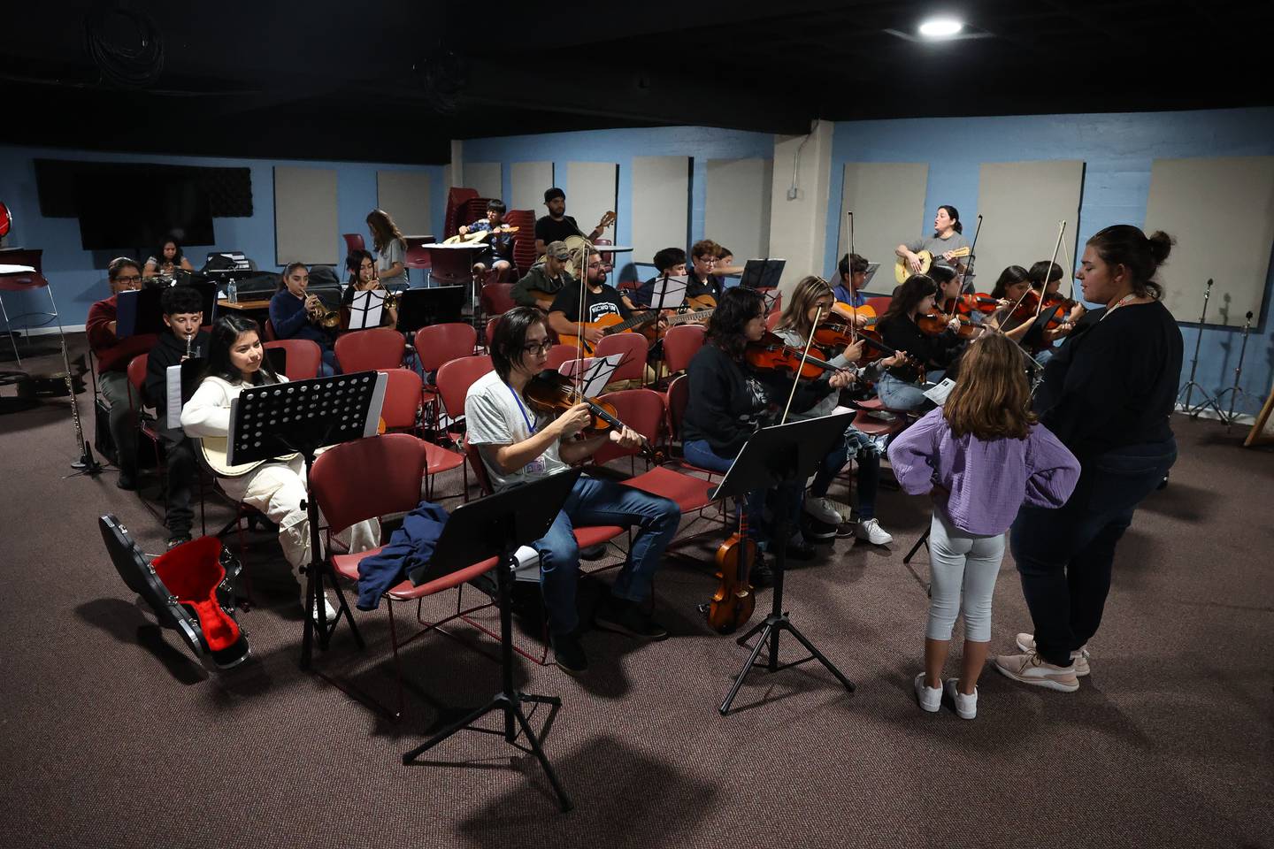 Mariachi de Joliet, a community Mariachi band, practices for an upcoming fundraiser performance at the Rialto Square Theatre in Joliet.