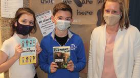 Troy students review newly released books for new online program 