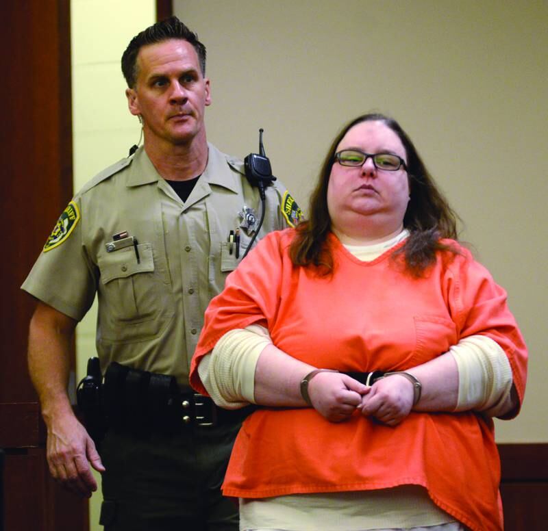 Sarah Safranek is escorted into an Ogle County courtroom on Monday for a motion hearing by Deputy Dan Daub.