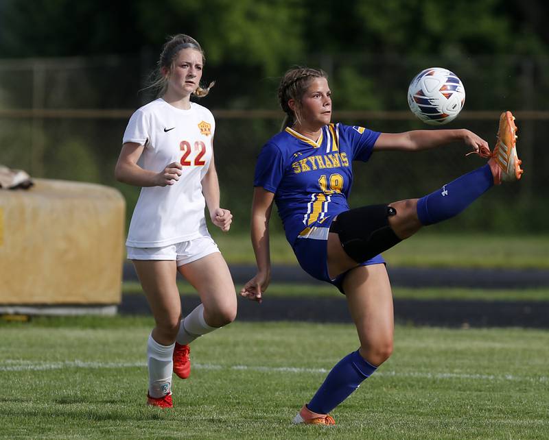 Johnsburg's Diamond Morales tries to kick the ball back towards the goal and over Johnsburg's Payton Koczersut during the IHSA Class 1A Marian Central Sectional Championship match on Tuesday, May 21, 2024, at Marian Central High School.