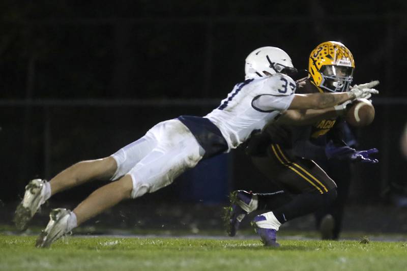 Cary-Grove's Matthew Maka breaks up a pass intended for Jacobs' Jaylen Langley during a Fox Valley Conference football game on Friday, Oct. 24, 2025, at Jacobs High School in Algonquin.