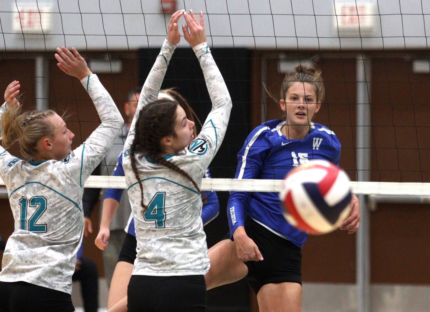 Woodstock’s Hallie Steponaitis follows the flight of a ball she sent over the net in varsity volleyball at Woodstock North Monday night.