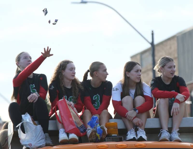 L-P volleyball players throw candy during the L-P Homecoming parade on Thursday, Oct. 5, 2023 downtown La Salle.