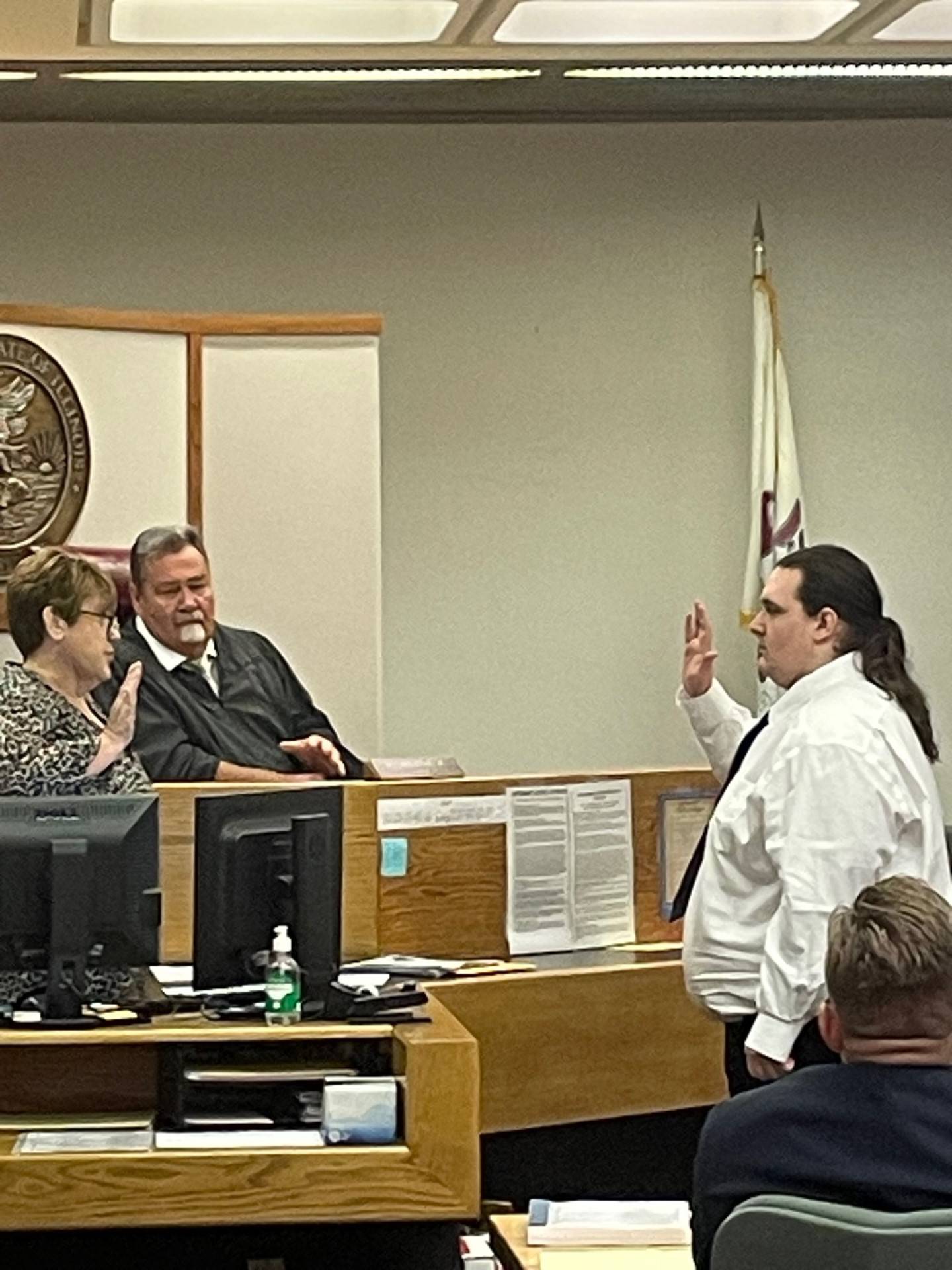 Bradley French (right) swears to tell the truth before testifying Aug. 16, 2023, in front of Chief Judge H. Chris Ryan Jr. in La Salle County Circuit Court. French then admitted firing a razor-tipped arrow at Joshua Scaman, killing him, but that he did so in self-defense.