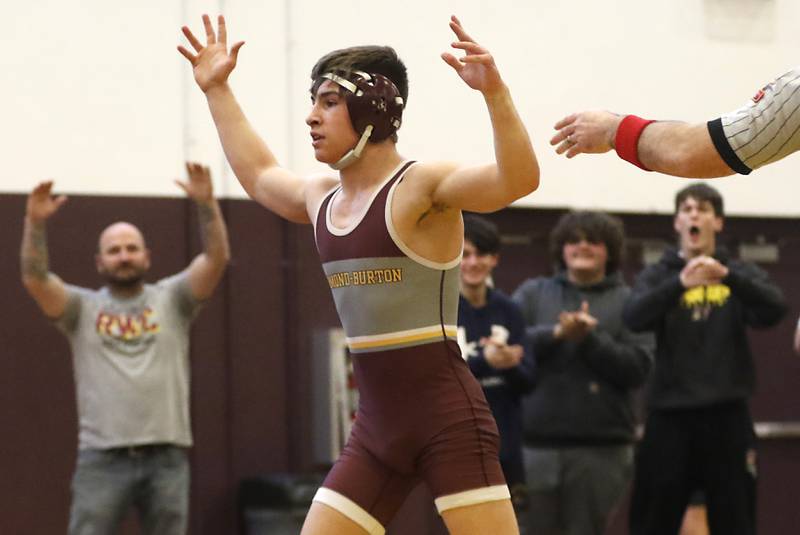 Richmond-Burton’s Emmett Nelsen celebrates defeating Marian Central’s Kaden Harman in the 126-pound championship wrestling match in the IHSA 1A Richmond-Burton Wrestling Regional Thursday, Jan. 19, 2023, at Richmond-Burton High School in Richmond.