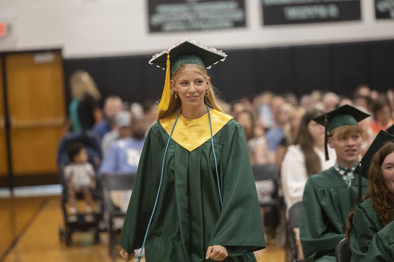Rock Falls class of 2026 representative Katalina Scott heads to the stage to begin her speech Sunday, May 17, 2026, during the high school’s commencement.