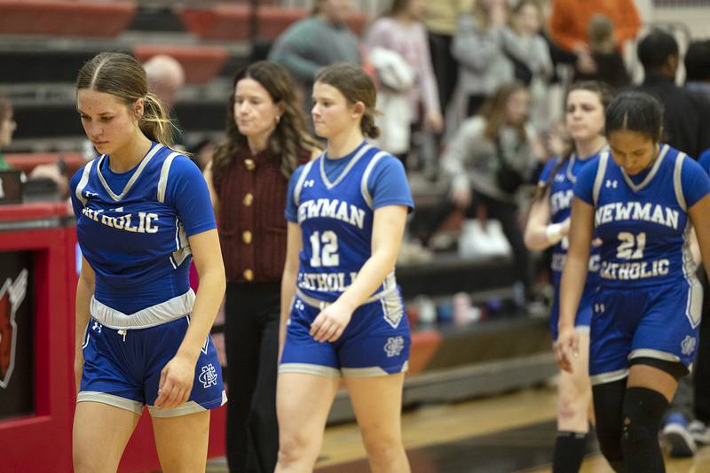 Newman players come off the court following their 48-43 loss to River Ridge Thursday, Feb. 20, 2025, during the Class 1A girls basketball regional at Forreston.
