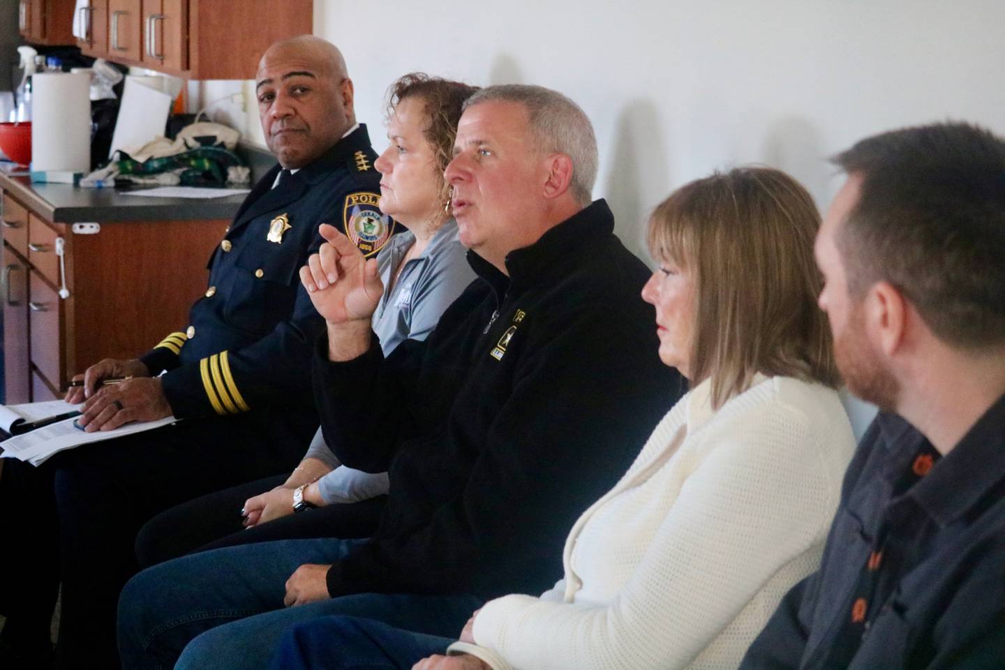 DeKalb Mayor Cohen Barnes (center) speaks to residents while other local leaders look on (from left) DeKalb police chief David Byrd, city community services coordinator Jennifer Yochem, Barnes, 2nd Ward Alderman Barb Larson and DeKalb School District 428 school board member Nick Atwood. Barnes spoke during a community meeting hosted by local officials meant to allow residents to express goals and concerns held on Nov. 15, 2025, at University Village in DeKalb.