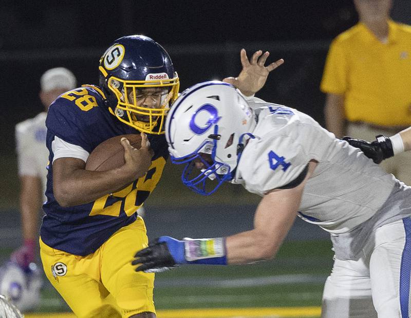 Sterling’s Marice De La Cruz is hit by Quincy’s Mason Dent Friday, Oct. 17, 2025.