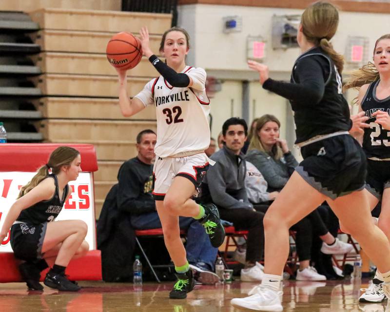 Yorkville's Lainey Gussman (32) looks to pass off of the break during varsity basketball game between Kaneland at Yorkville. Dec 14, 2022.