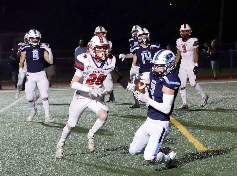 Prospect's Jake Parisi (2) hauls in a touchdown pass against St. Rita's Connor Atrtis (28) during the second round of the IHSA Class 7A Playoffs Friday November 4, 2022 in Mount Prospect.