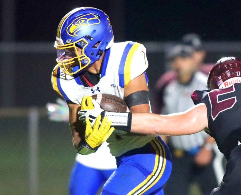Johnsburg’s Mario Zakzrewski runs the ball in varsity football at Rod Poppe Field on the campus of Marengo High School in Marengo on Friday, Oct. 3, 2025.
