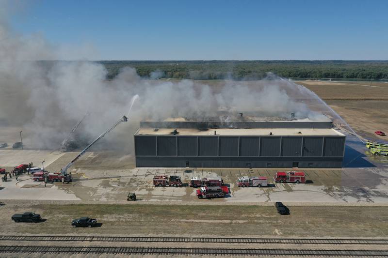 Smoke billows from Marquis Energy as firefighters work to control a structure fire on Wednesday, Oct. 8, 2025 in Hennepin. The fire was upgraded to a 5th alarm dispatching the (MABAS) Mutual Aid Box Alarm System. The fire broke out around 11a.m.