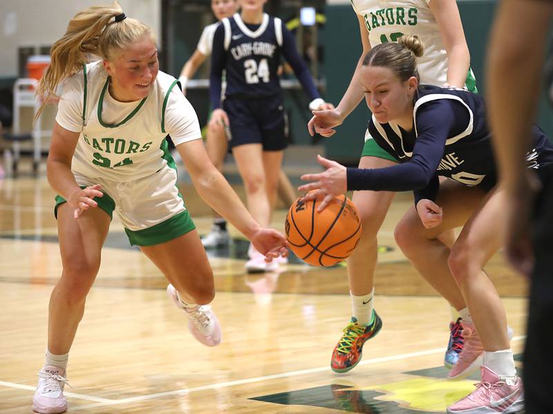 Crystal Lake South's Gracey LePage tries to steal the ball from Cary-Grove's Ava Santucci during a Fox Valley Conference girls basketball game on Friday, Jan. 23, 2026, at Crystal Lake South High School.