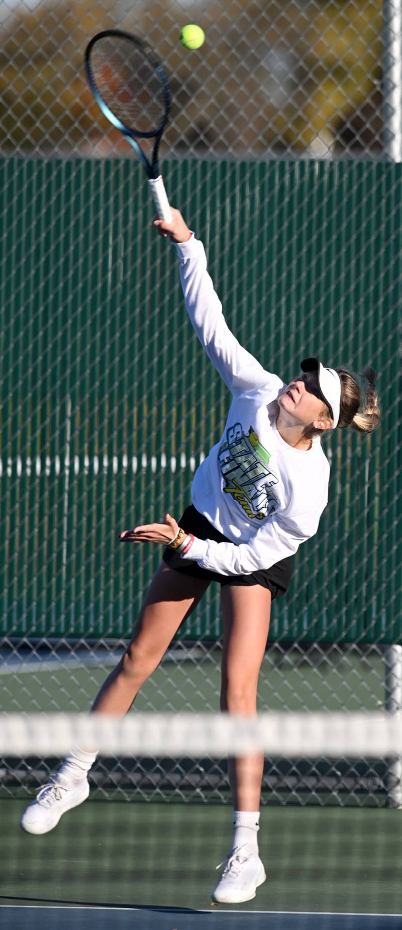 Hinsdale South's Addy Filipiak serves during Class 1A singles third-place match of the girls state tennis tournament at Hersey High School on Saturday, Oct. 26, 2024 in Arlington Heights.