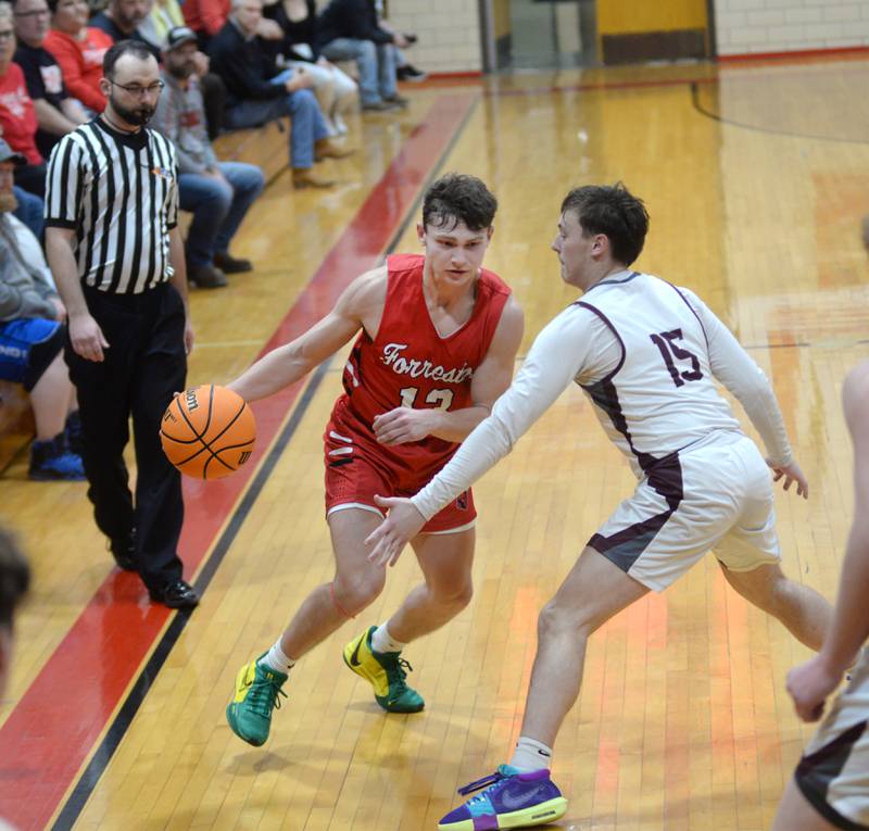 Forreston's Kendall Erdmann (13) drives on Dakota's Brody Keeney (15) during Tuesday, Dec. 17, 2024 action at the 63rd Annual Forreston Holiday Tournament.