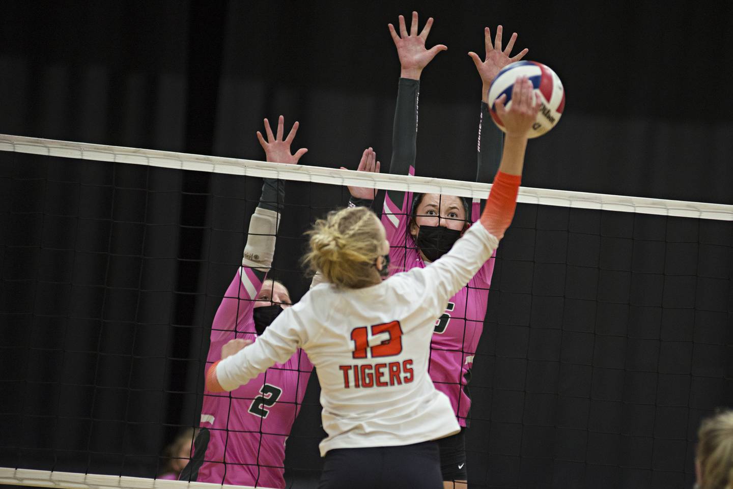 Rock Falls' Cadence Stonitsch (left) and Mallory Pinske go up to block a shot by Byron's Addyson Myers Tuesday, Oct. 5, 2021.