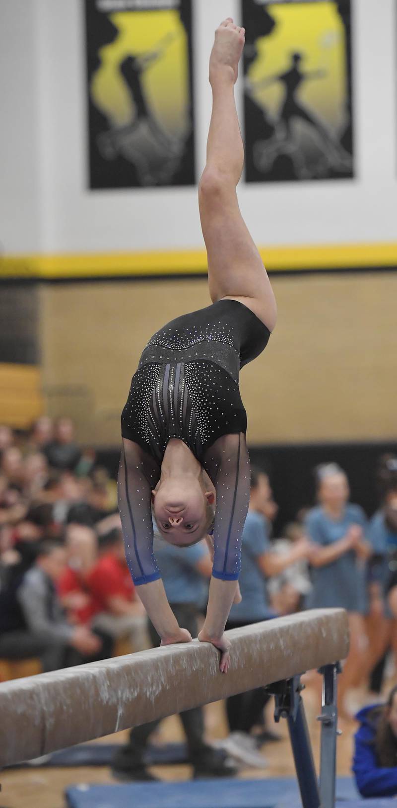 Geneva's Brooke Lussnig on the balance beam at the Hinsdale South girls gymnastics sectional meet in Darien on Tuesday, February 7, 2023.