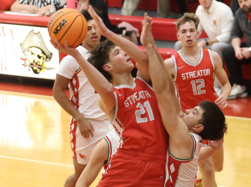 Streator's Brennen Stillwell eyes the hoop as L-P's Erick Sotelo defends during the Dean Riley Shootin' The Rock Thanksgiving Tournament on Monday Nov. 24, 2025 in Kingman Gymnasium at Ottawa High School.