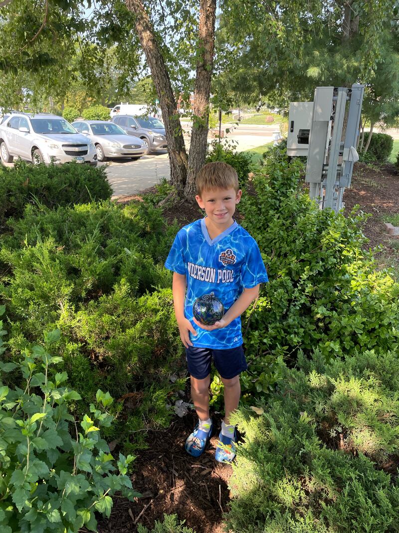Gus Manning, 7, found an ornament Thursday, July 25, 2024. He found the ornament at the Jordan block. "This is such a cool thing that Ottawa Visitor Center and Starved Rock Hot Glass has done. We’ve seen so many families out looking around town this week," his mother Cara Manning said.