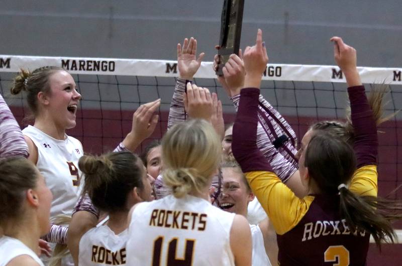Reagan Wisniewski, left, and the Richmond-Burton Rockets celebrate a two-set win over Genoa-Kingston in IHSA Class 2A Regional Title Game volleyball action on Thursday, Oct. 31, 2024, at  Marengo High School  in Marengo.