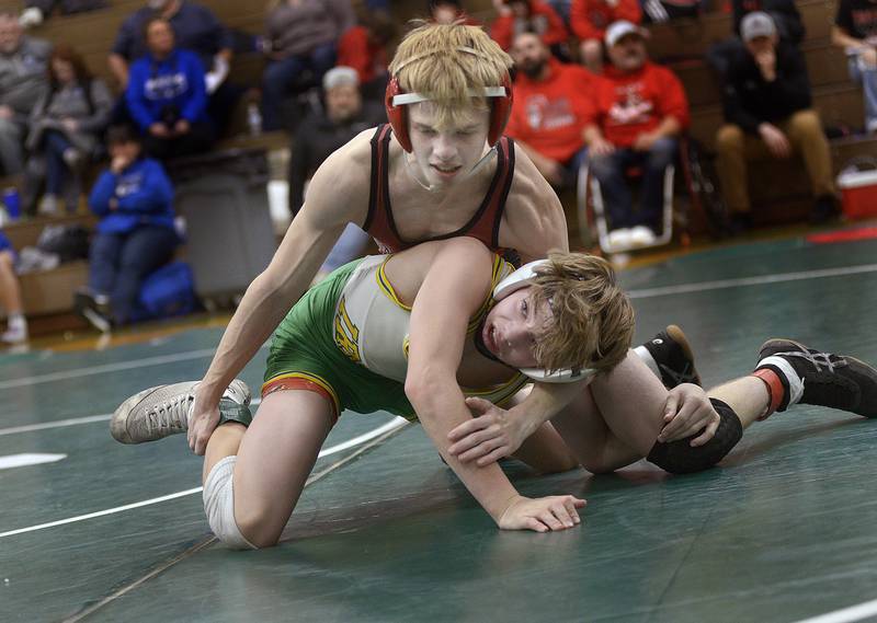 Seneca freshman Raiden Terry looks to escape from the hold of Streator senior Nicholas Pollett in the 106-pound championship match of the Seneca Fighting Irish Wrestling Invitational on Saturday at Seneca