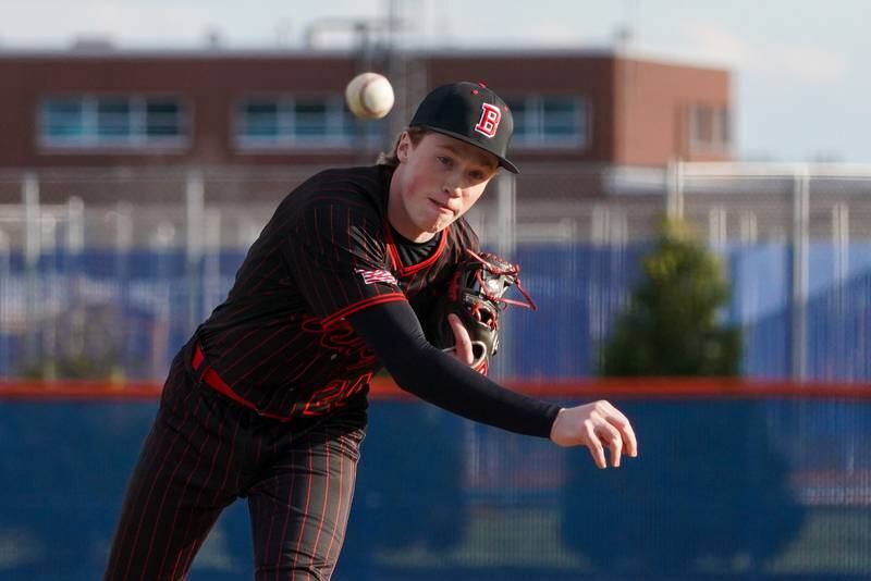 Benet’s Tristan Lakis (24) delivers a pitch against Oswego during a baseball game at Oswego High School on Tuesday, March 25, 2025.